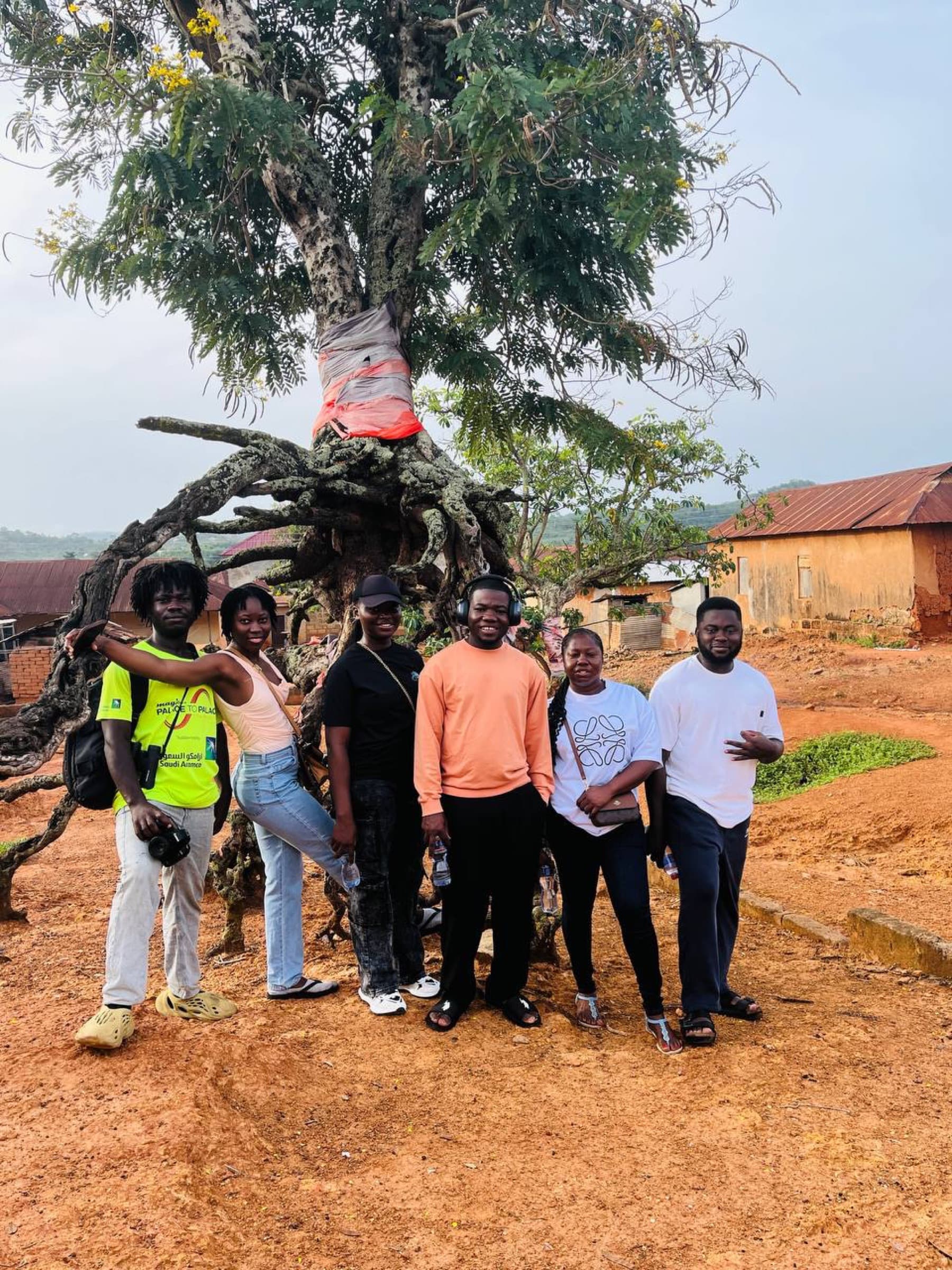 Group photo under a village landmark tree