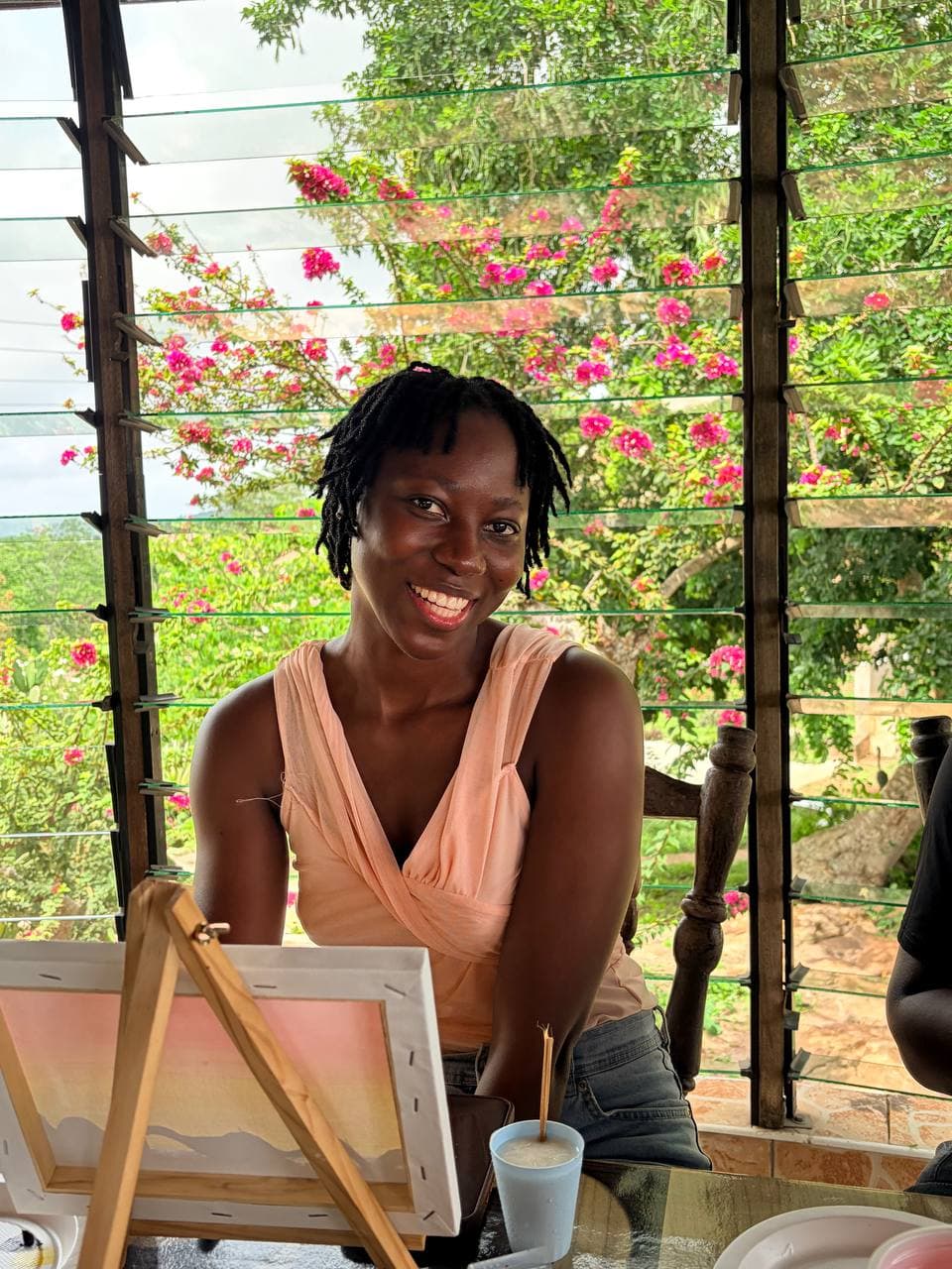 Painting session framed by bougainvillea