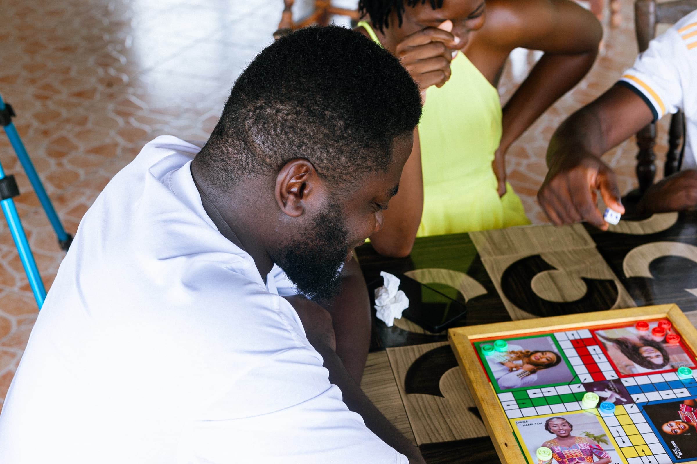 Close-up of a ludo board mid-game