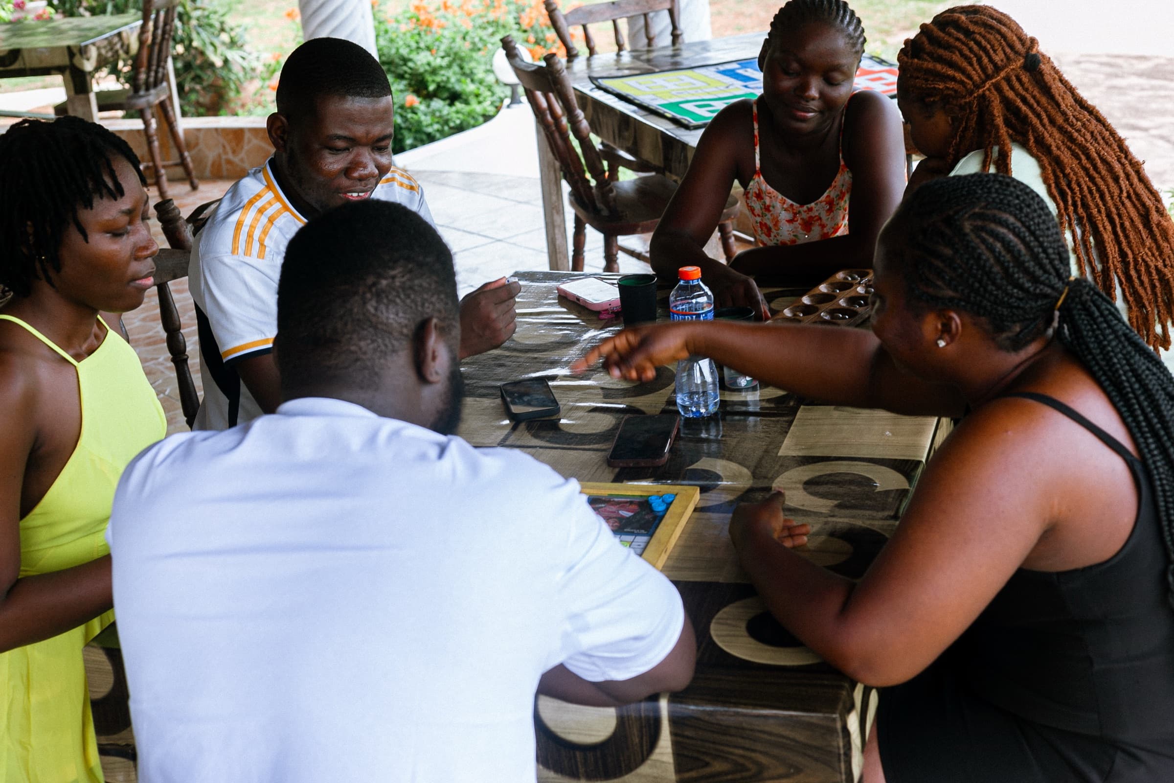 Friends gathered on a terrace at a FAYA Escape retreat