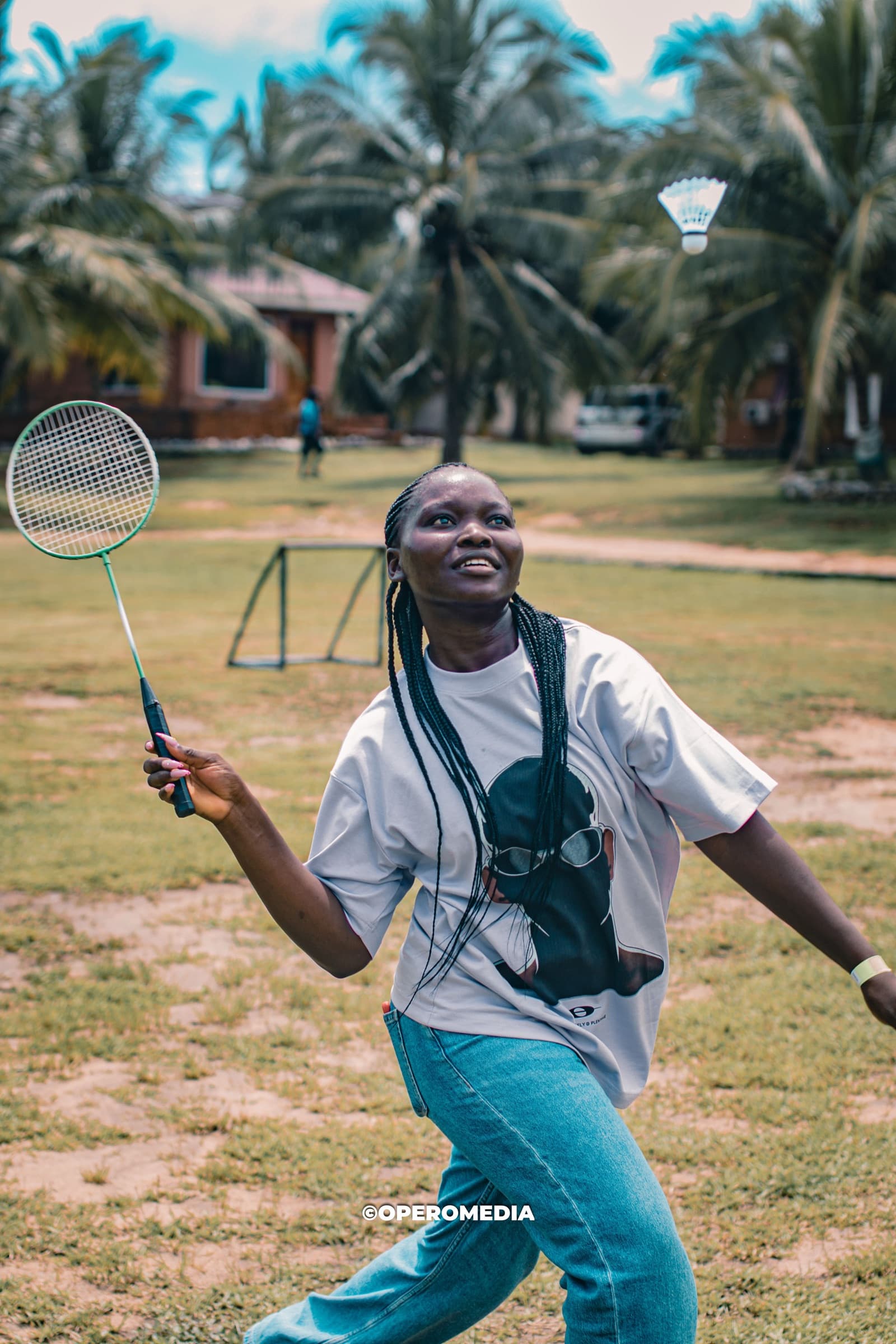 A guest mid-swing during a badminton match