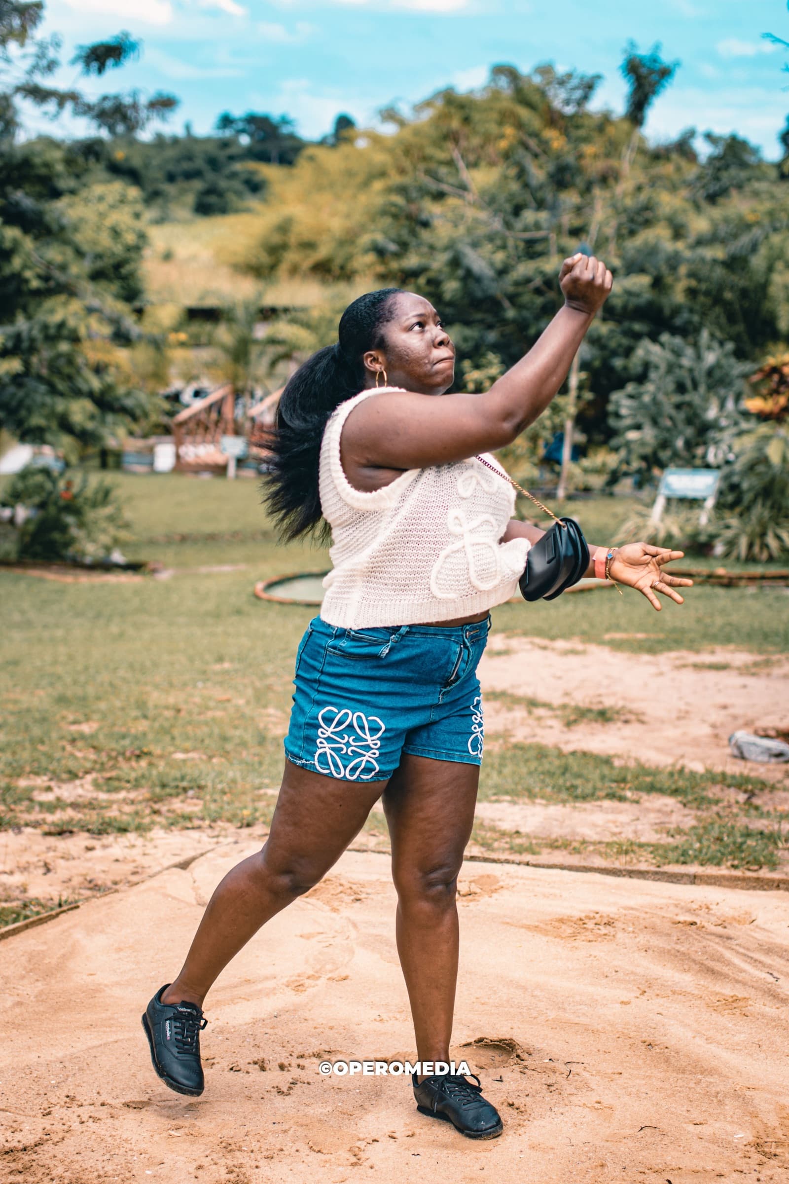A guest in mid-motion during an archery round